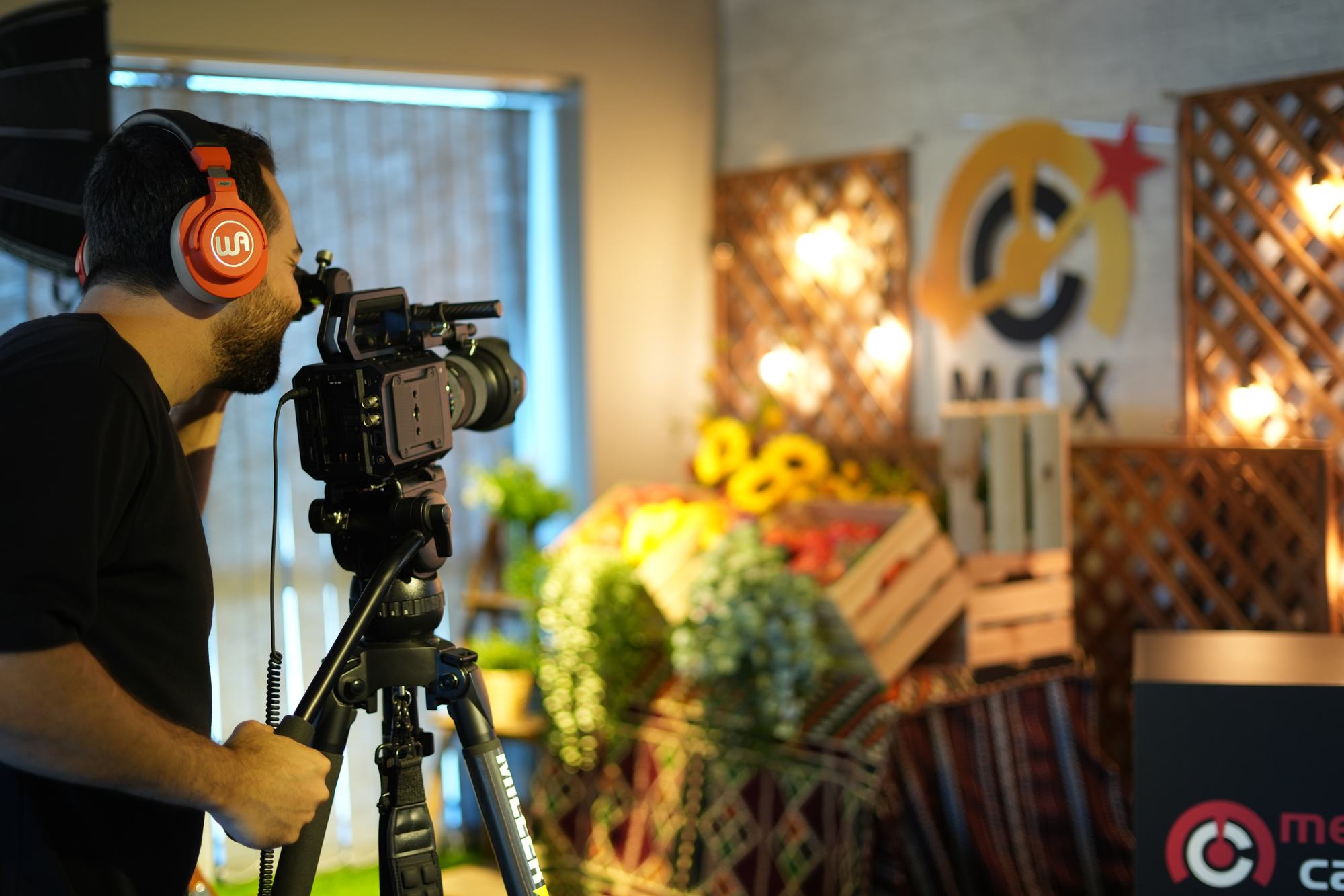 An operator behind a cinema camera on the MCX floor