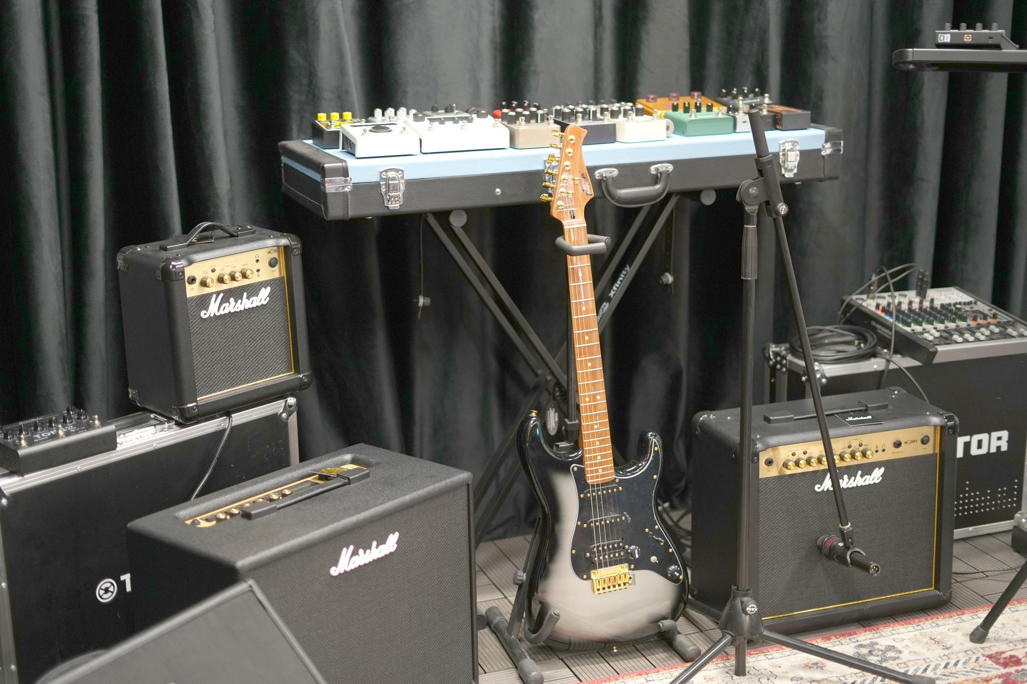 The stage at MCX, backline and microphones set up
