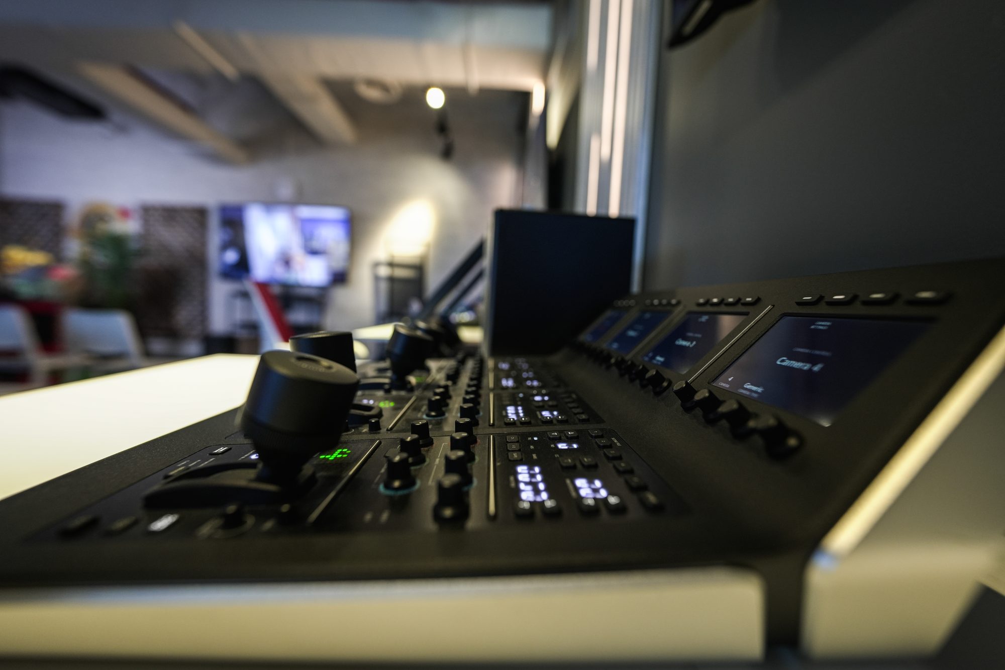 Close on a camera control panel, the camera labels lit