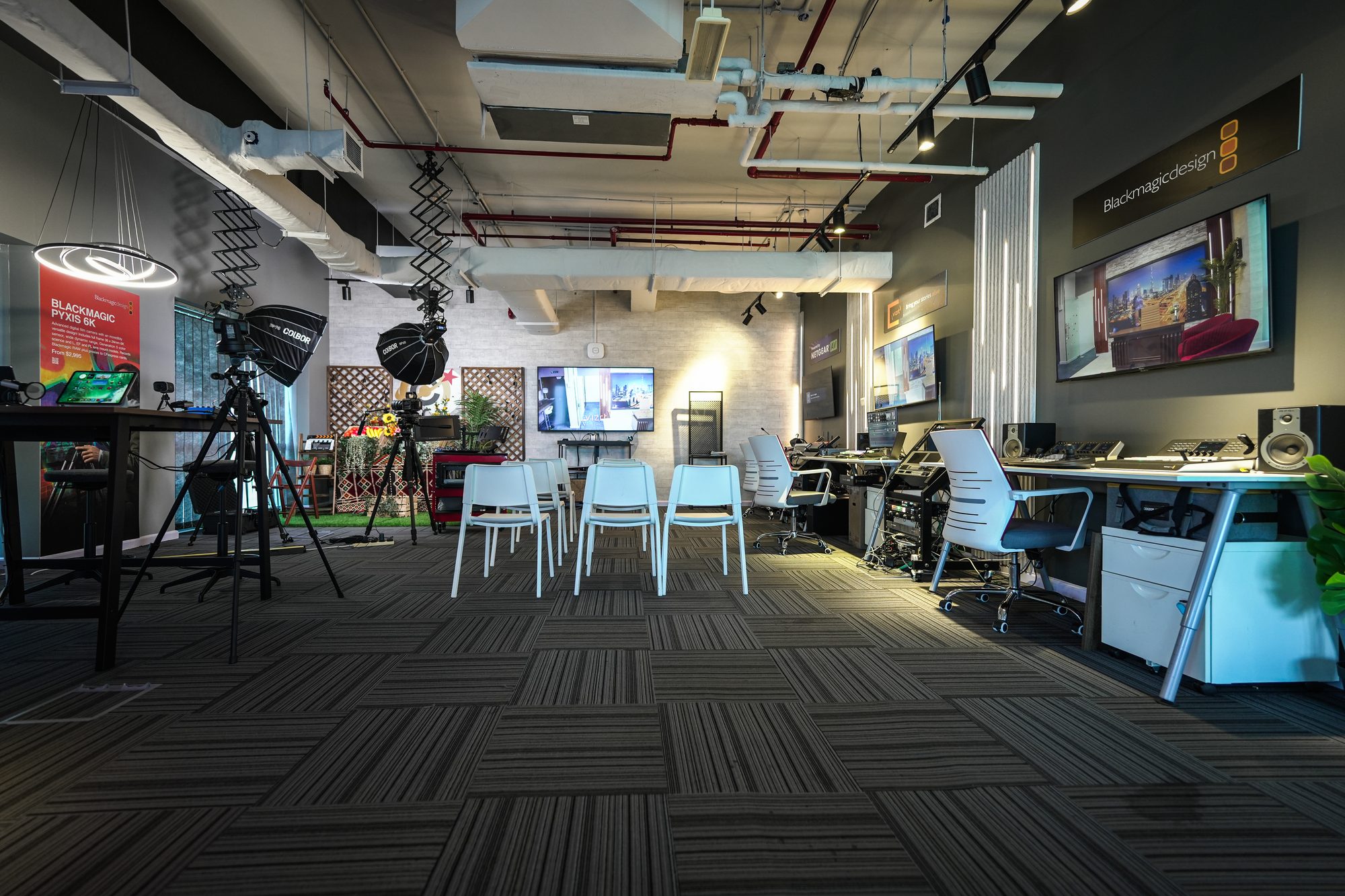 The MCX floor laid out for a session, chairs facing the set with the gallery bench alongside