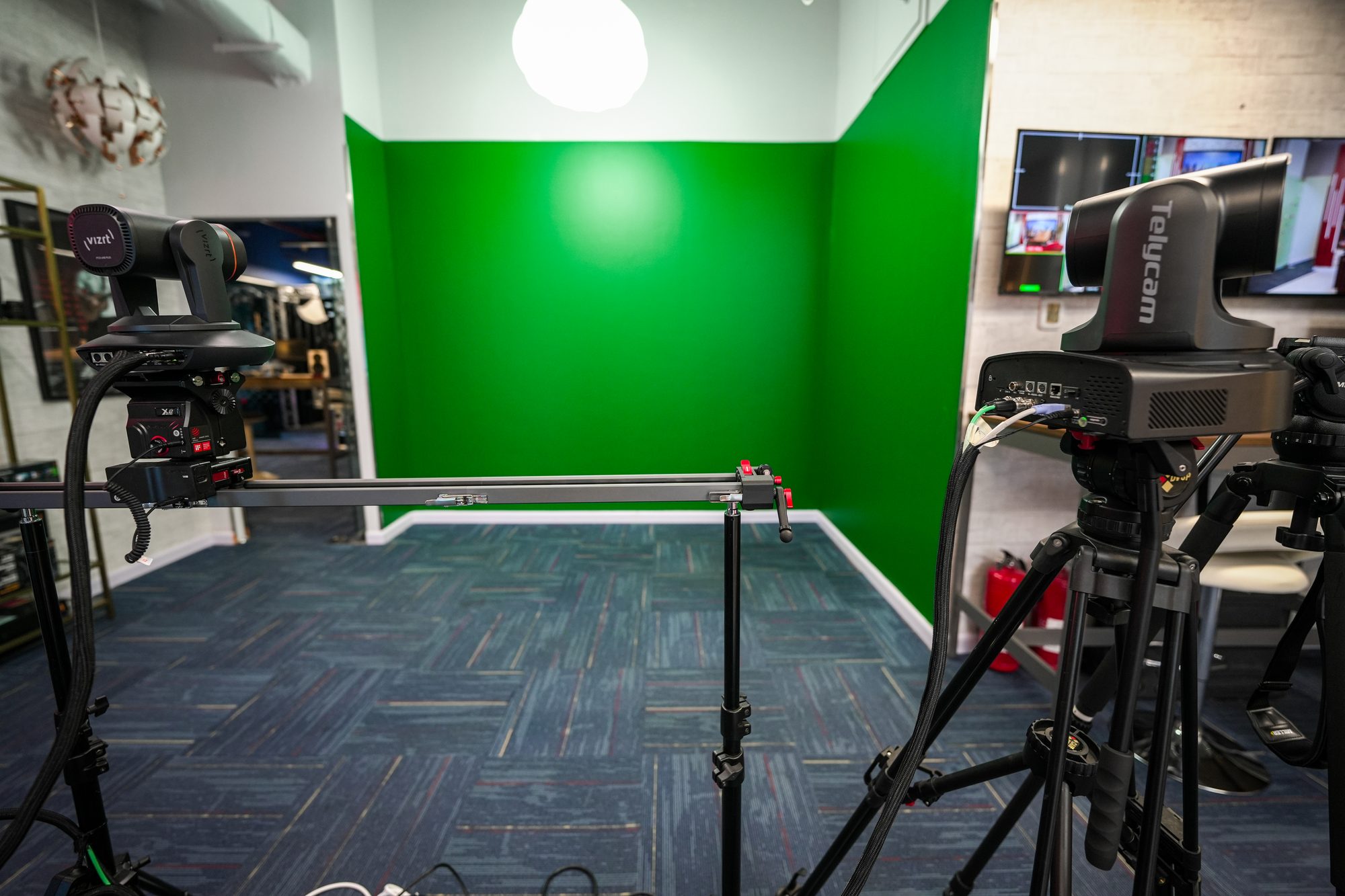 A PTZ camera tracking on the slider in front of the MCX green set