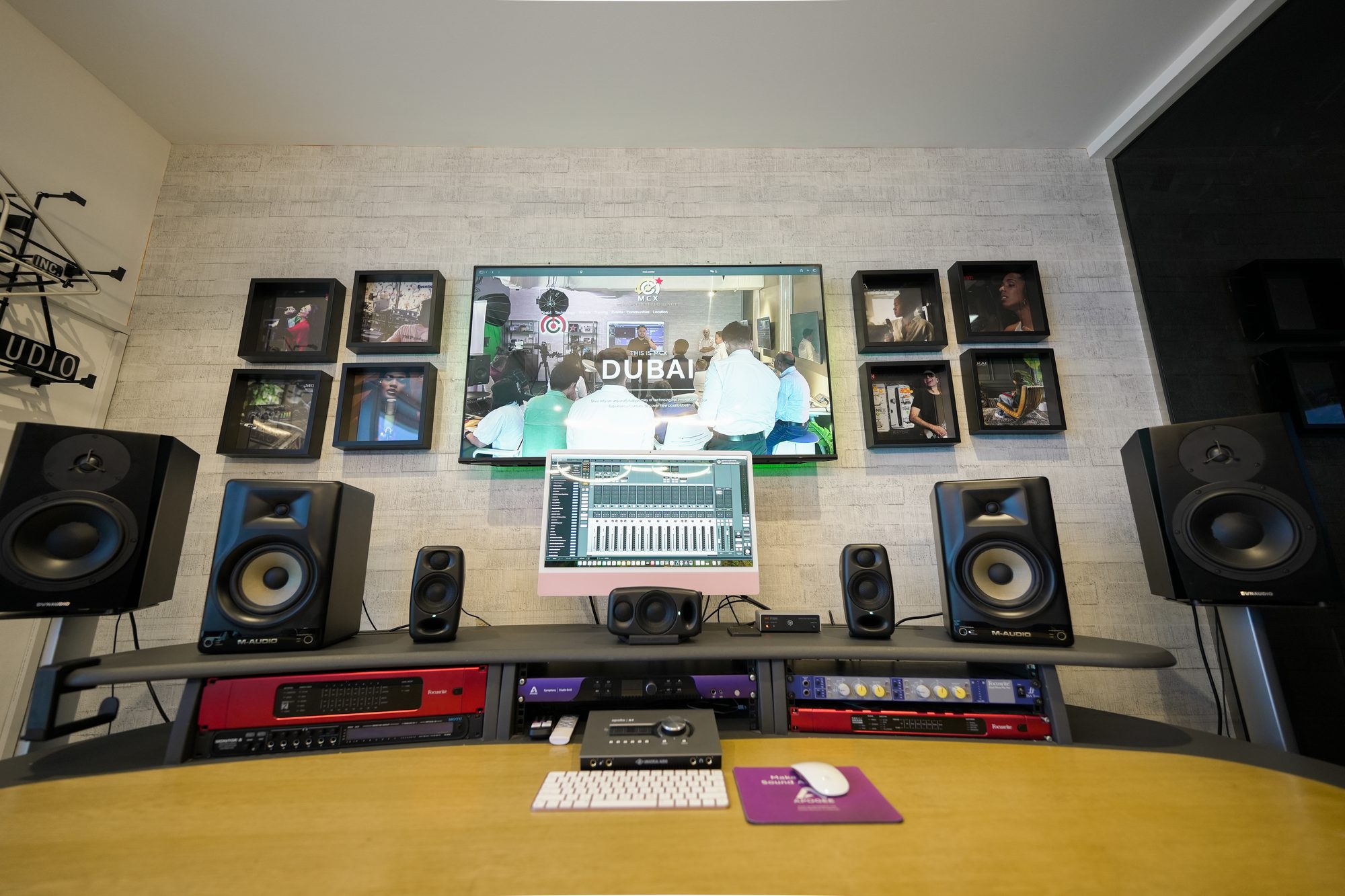 The recording room at MCX, monitoring and speakers across the desk