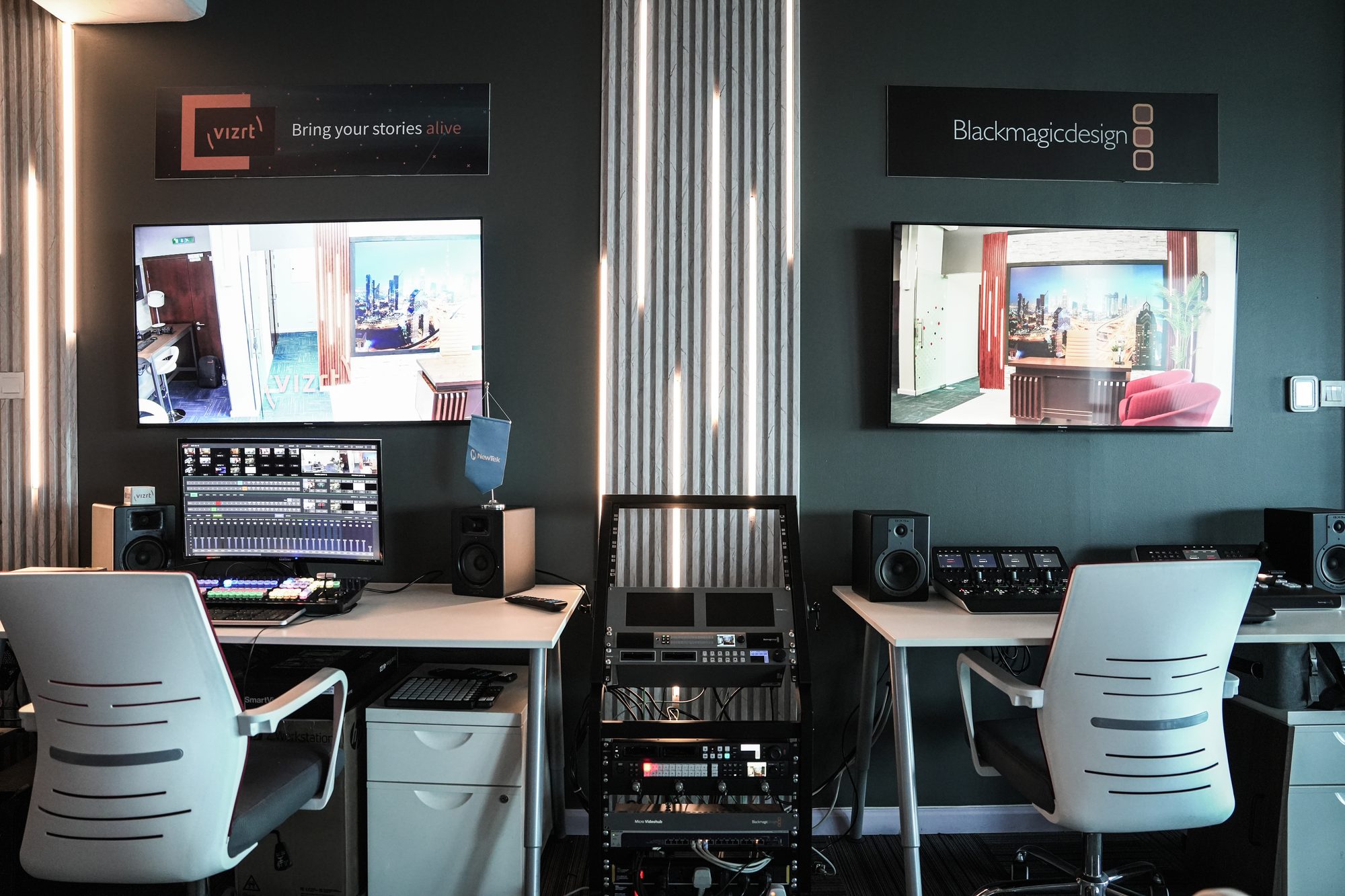 The live gallery at MCX, two operator positions facing the monitor wall